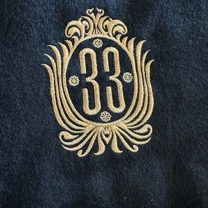 Elegant Black and Gold Embroidered 33 Emblem